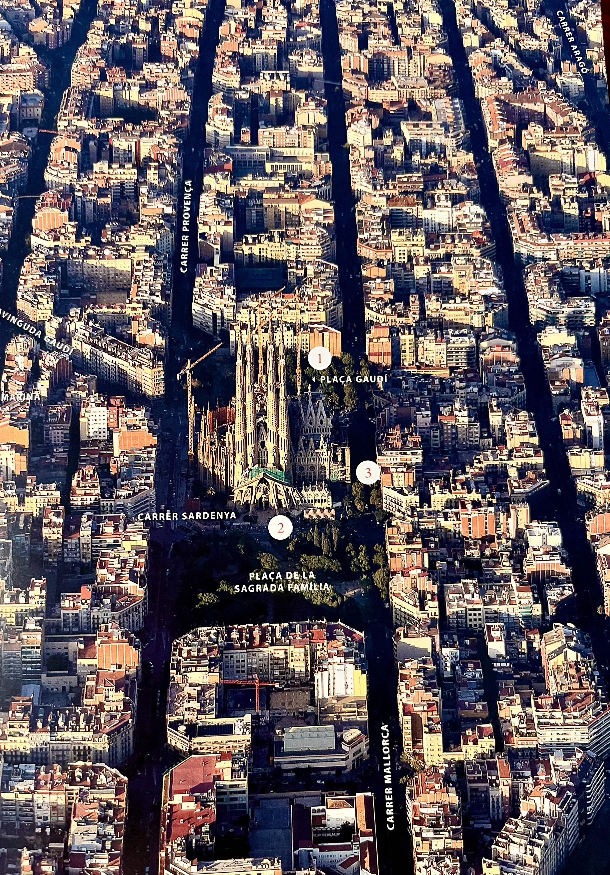 Aerial view of Barcelona city with streets, buildings, and the Sagrada Família church visible at the bottom center, marked by a number 3, with nearby streets labeled Carrer Sardenya, Carrer Aragó, Carrer Provença, and Carrer Mallorca.