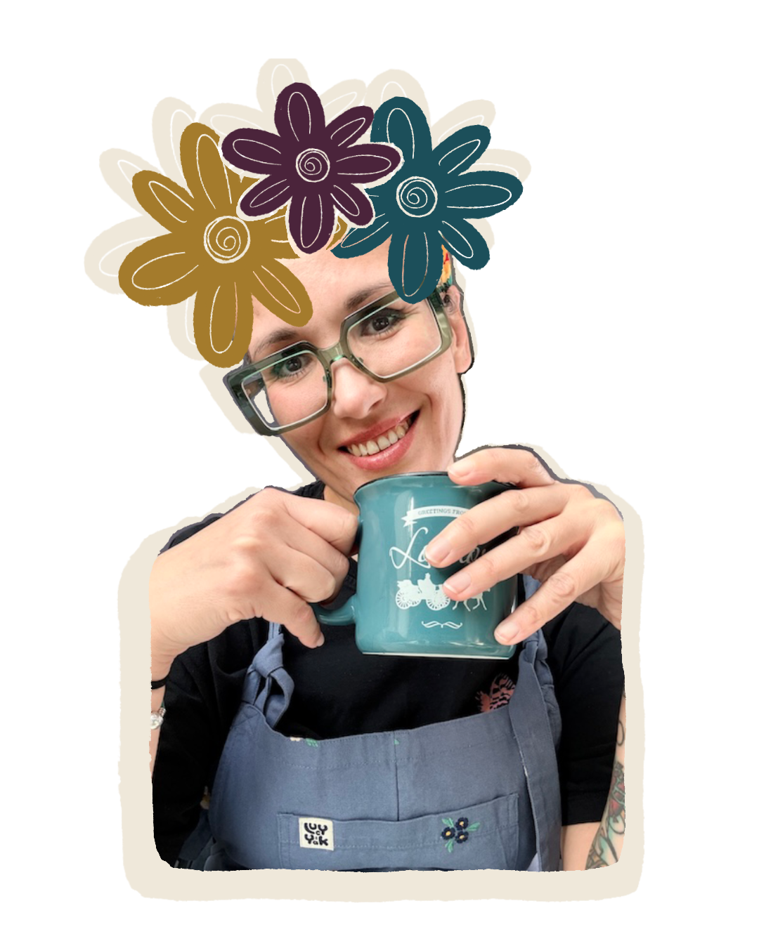 Smiling woman with glasses and a floral headpiece holding a turquoise mug.