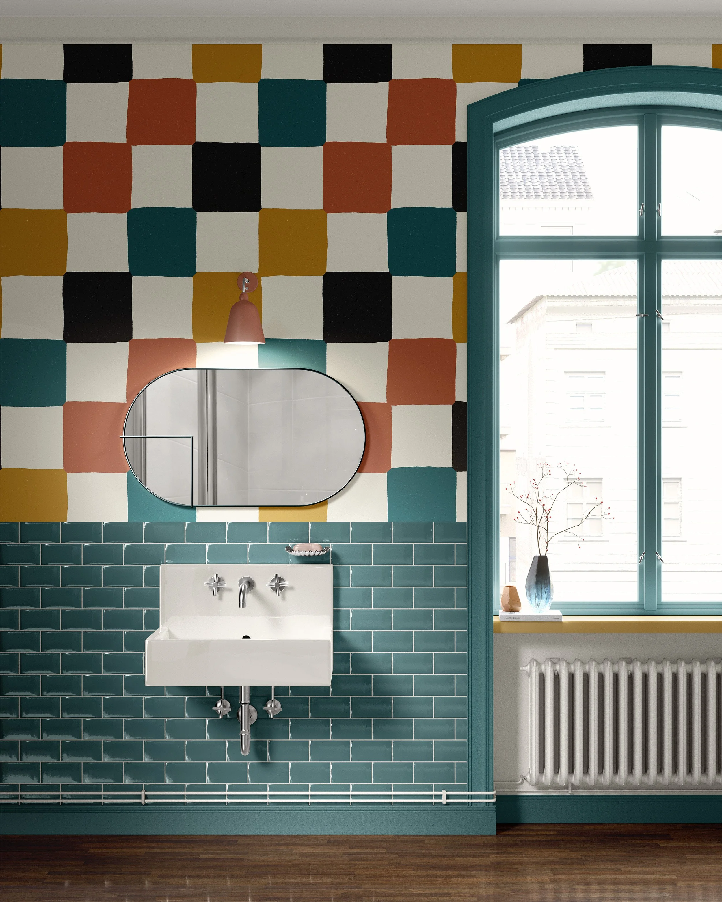 Interior view of a bathroom with colorful geometric tiled wall, a white sink with chrome fixtures, an oval mirror, a window with blue trim, and decorative items on the window sill.