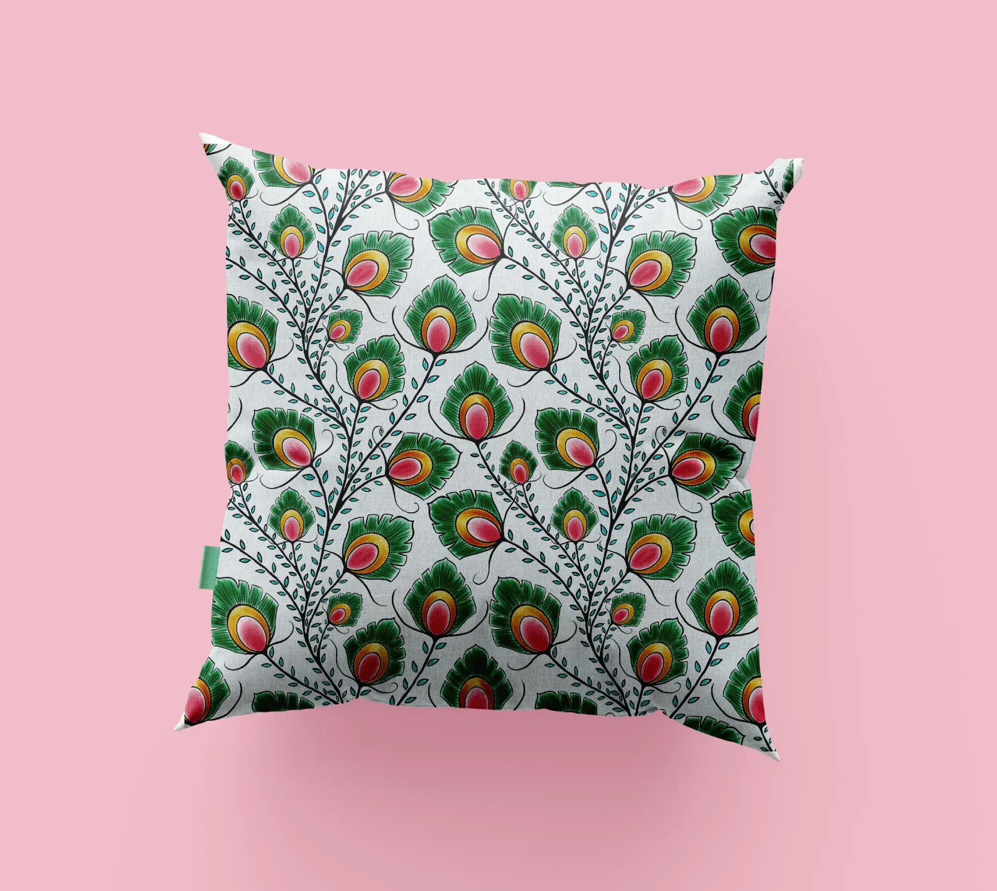 Decorative pillow with a peacock feather folkloric pattern on a pink background.