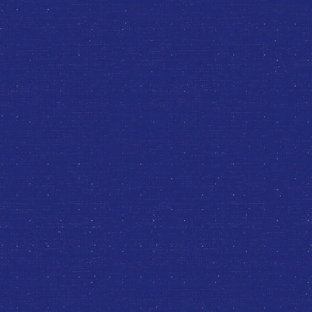 Close-up of a deep blue fabric with tiny white dots resembling a starry night sky.