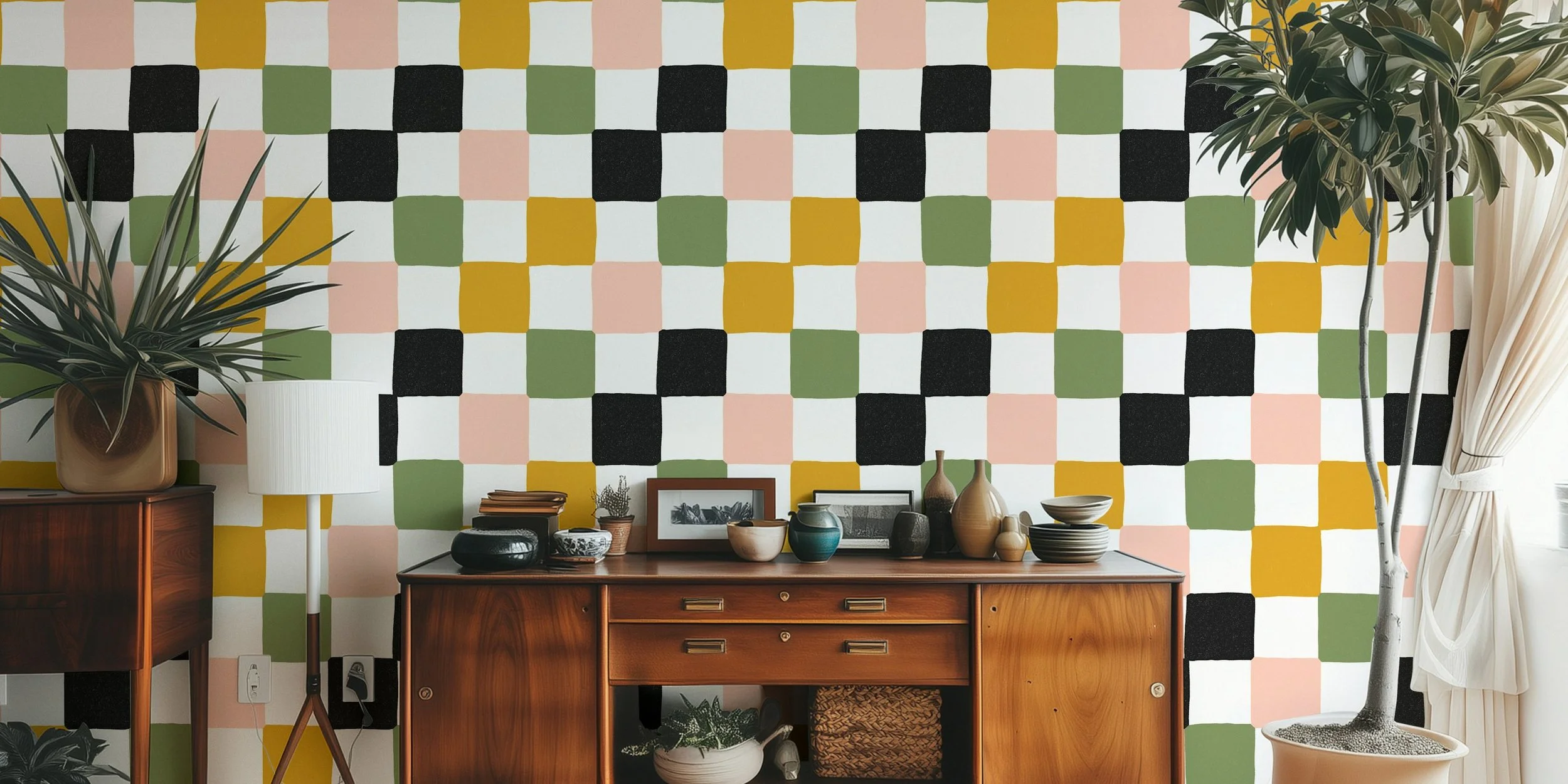 Mid-century wooden sideboard against a colorful, geometric-patterned wall with potted plants, framed pictures, and decorative bowls and vases on top.