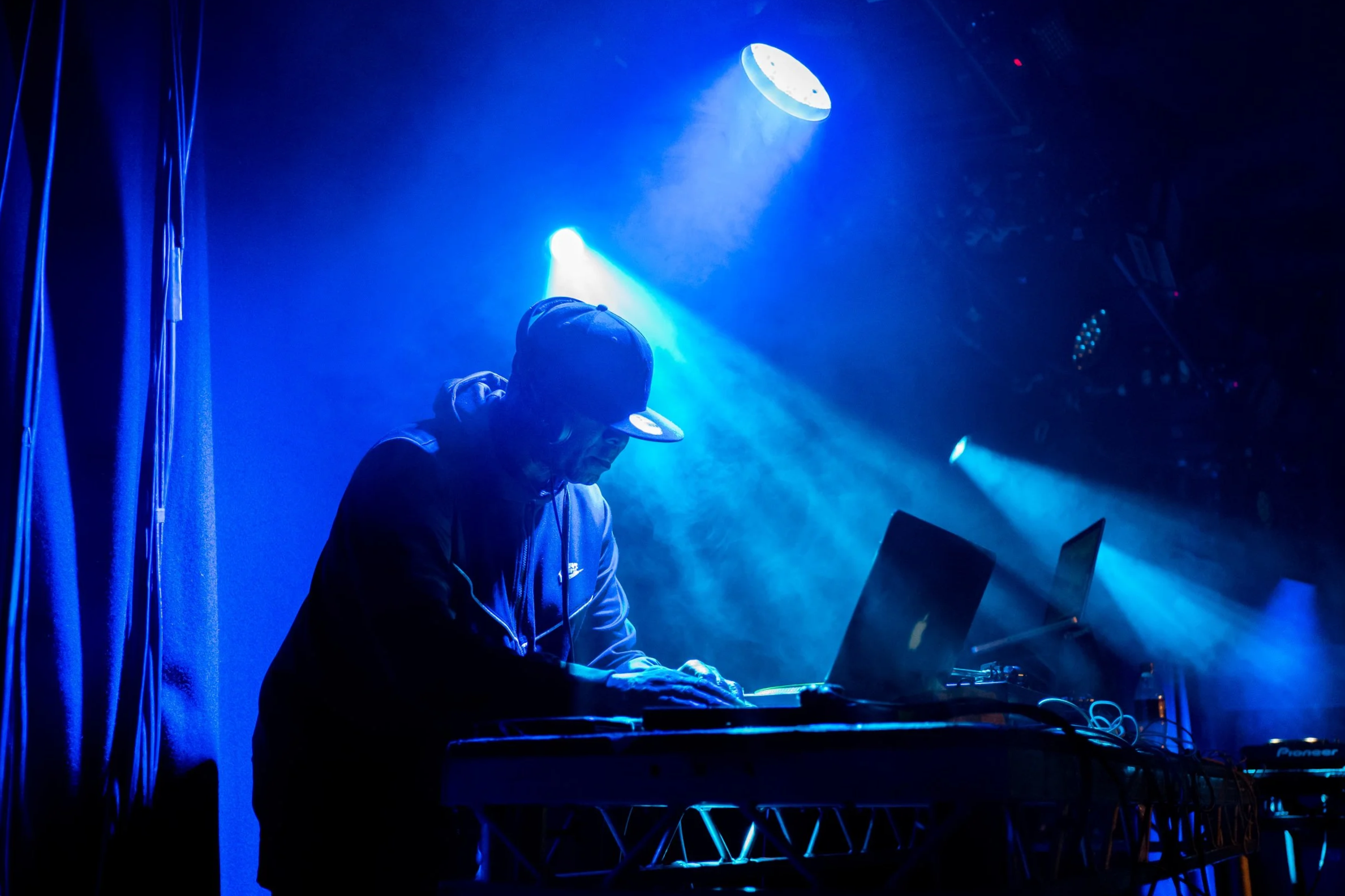 DJ The Numberman working the record decks at a party