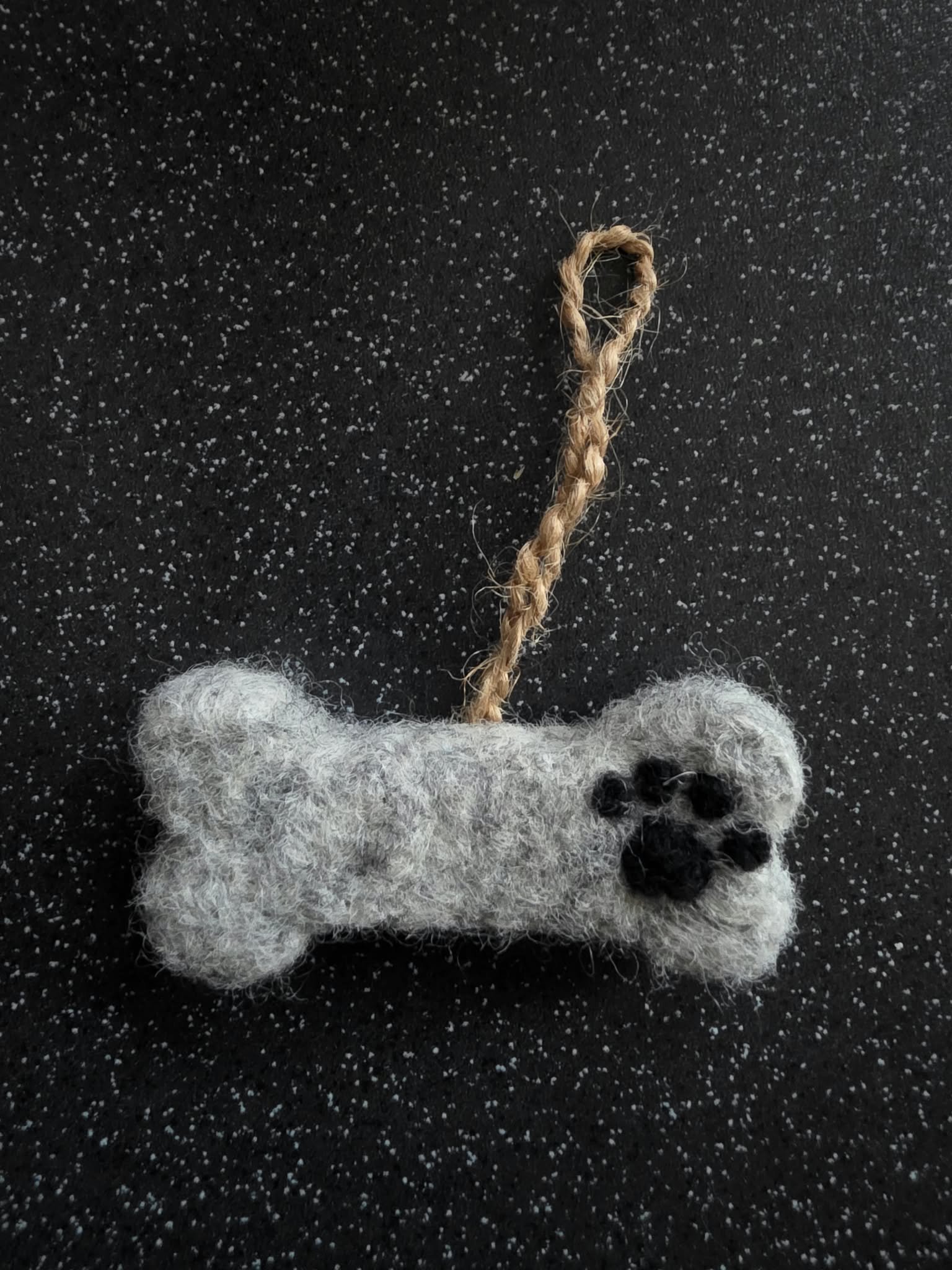 Needle felted hanging bone shape with paw print