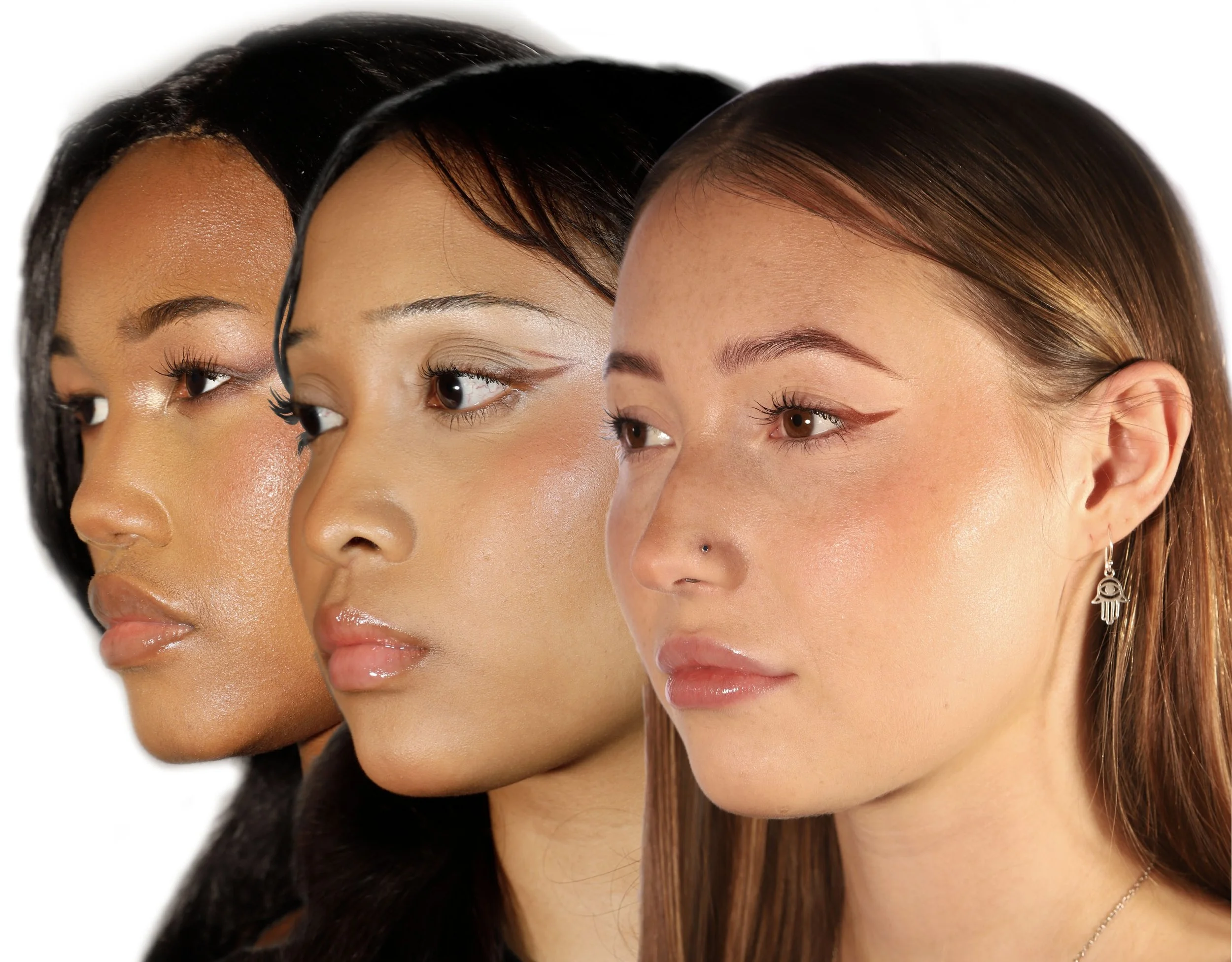 Three women with different complexions and hair colors, featuring makeup and earrings, looking to the right.