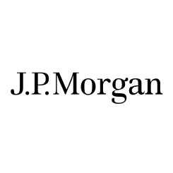 Silhouette of a person climbing a mountain at sunset.