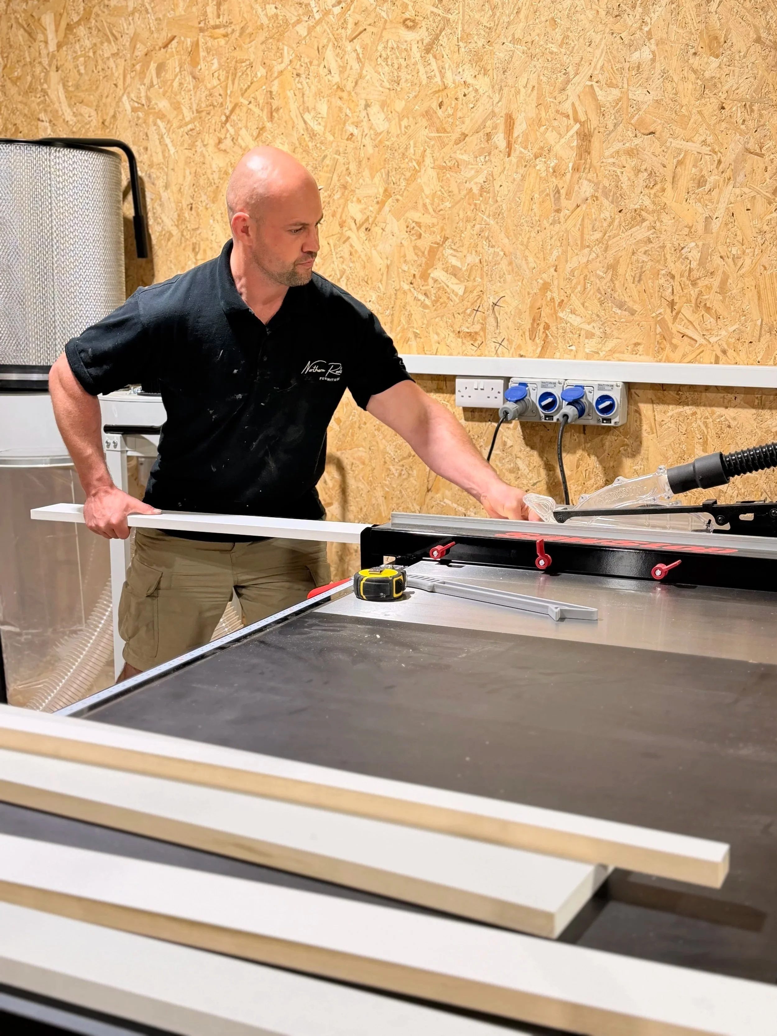 Solid tulipwood face frames being cut and prepared in the workshop.