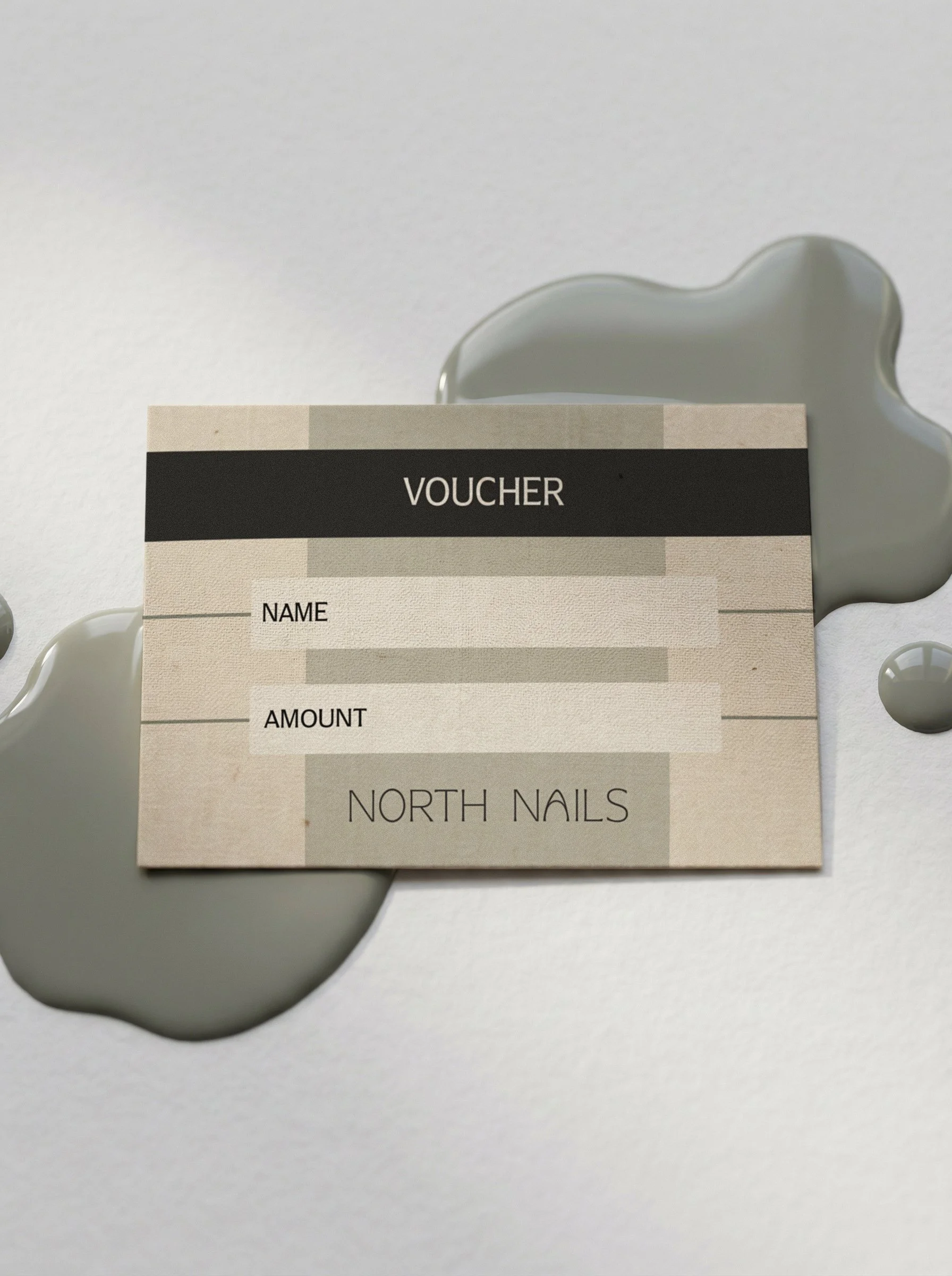 Close-up of a voucher with blank fields for name, amount, and notes, placed on a reflective surface with a gray, irregularly shaped decorative element in the background.