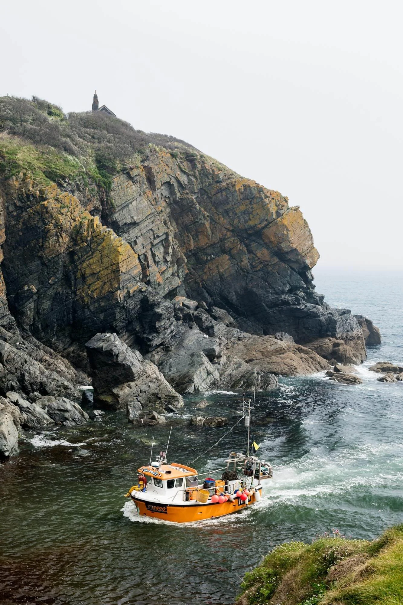 Fisherman's Boat Returning with Catch of the Day to Cadgwith Cove, Cornwall.