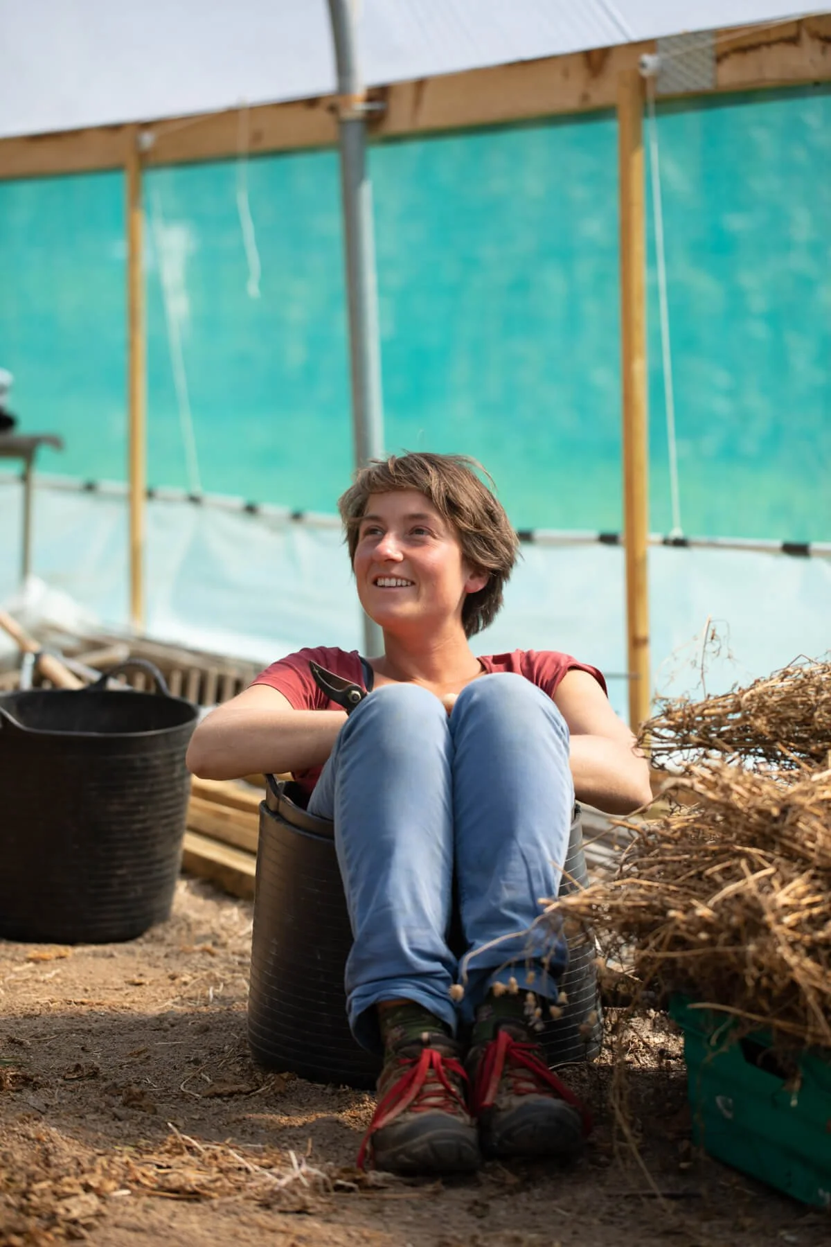 Ronja Schlumberger sat In Gardening Bucket Inside Poly Tunnel