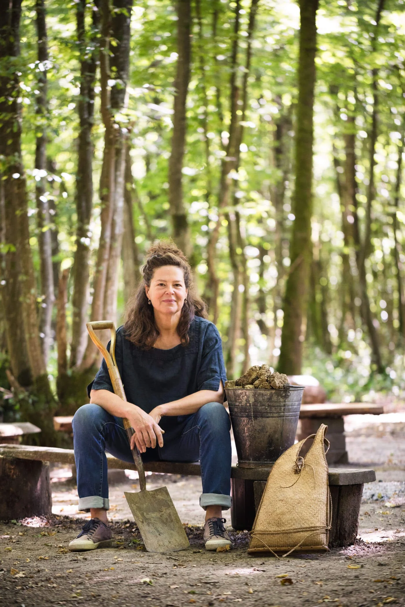 Environmental Portrait Ruby Taylor, Next to Spade and Bucket of Clay