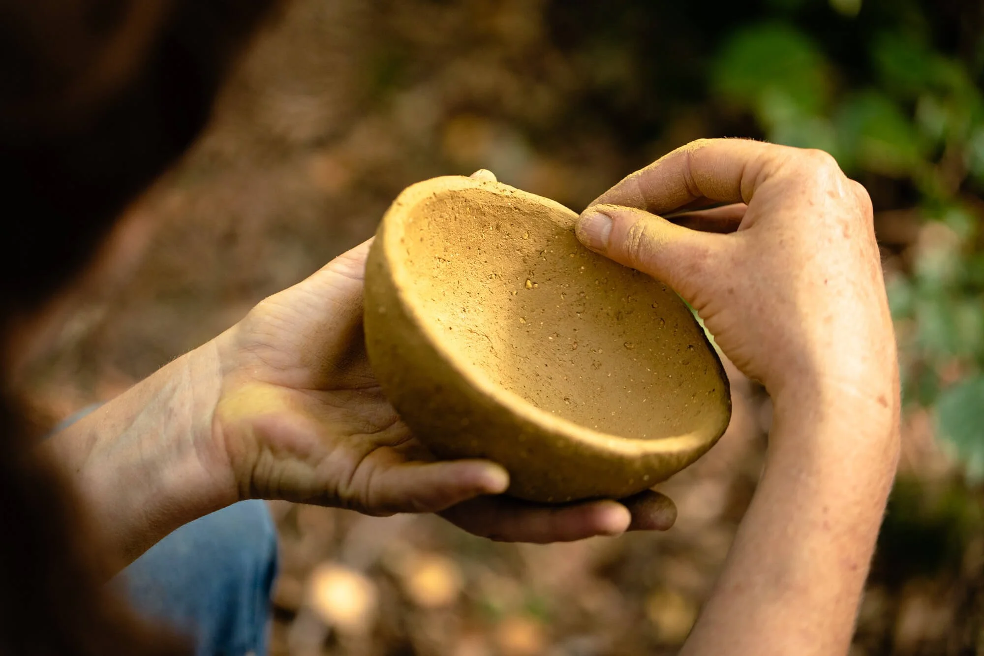 Close-Up, Hands Finishing Touches on Wild Clay Open Fire Pottery