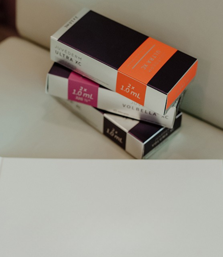 Three boxes of Voltellac Ultra XC medication stacked on a white surface.