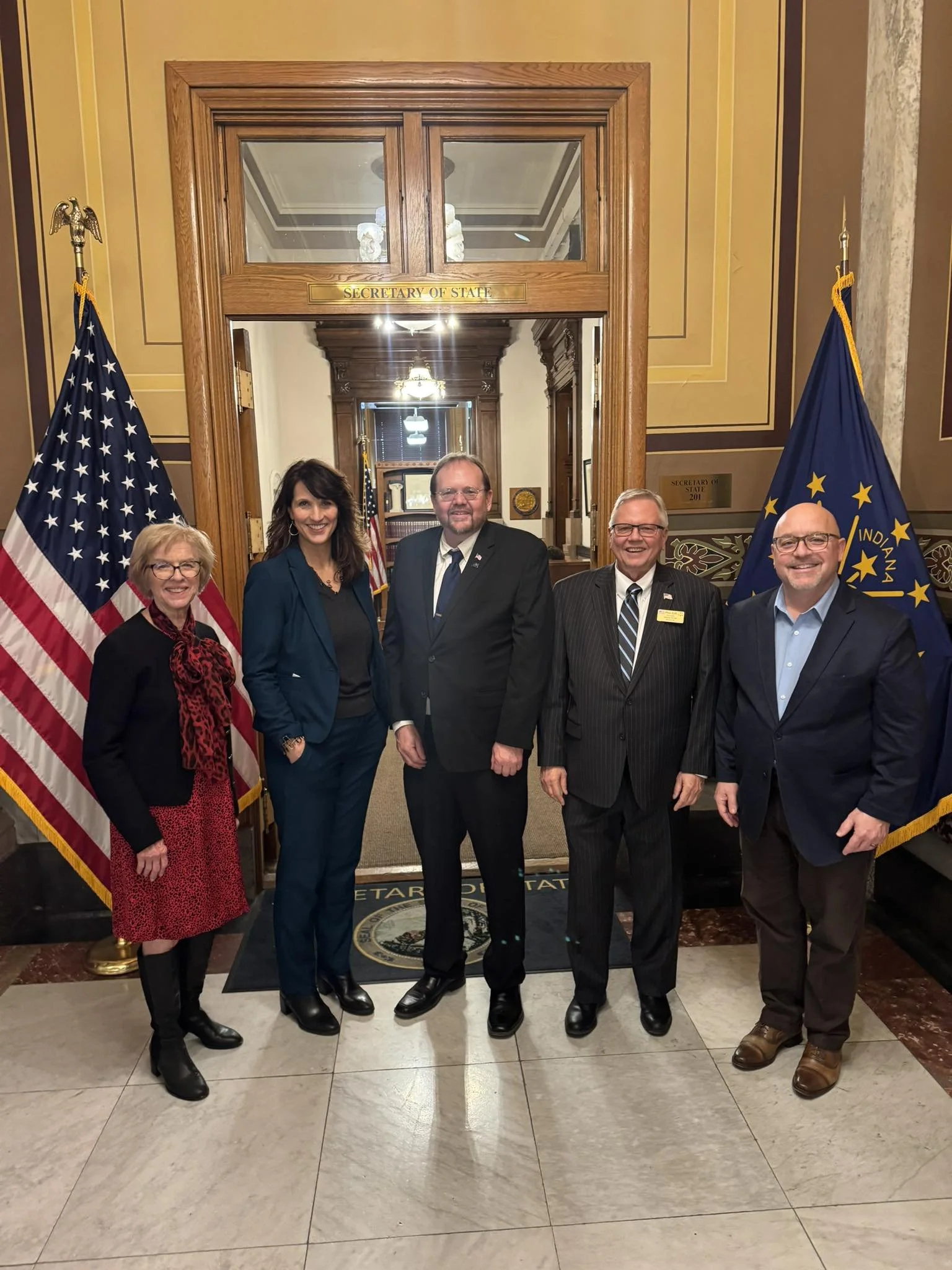 Sara Gullion poses along with Representative Sue Errington and 3 other democratic candidates filing for 2026 candidacy at the Indiana State House.