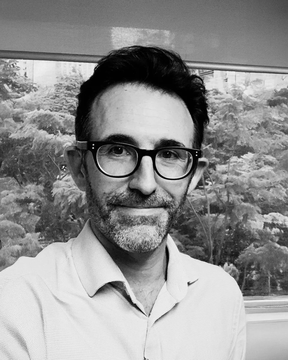 A black and white professional portrait of a psychiatrist