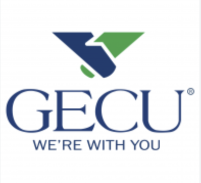 Close-up of sandy shoreline with water creating ripples and light reflections.