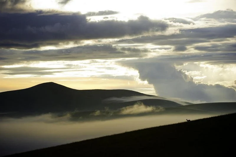The vast rolling grasslands and skies of Nyika National Park, Malawi.