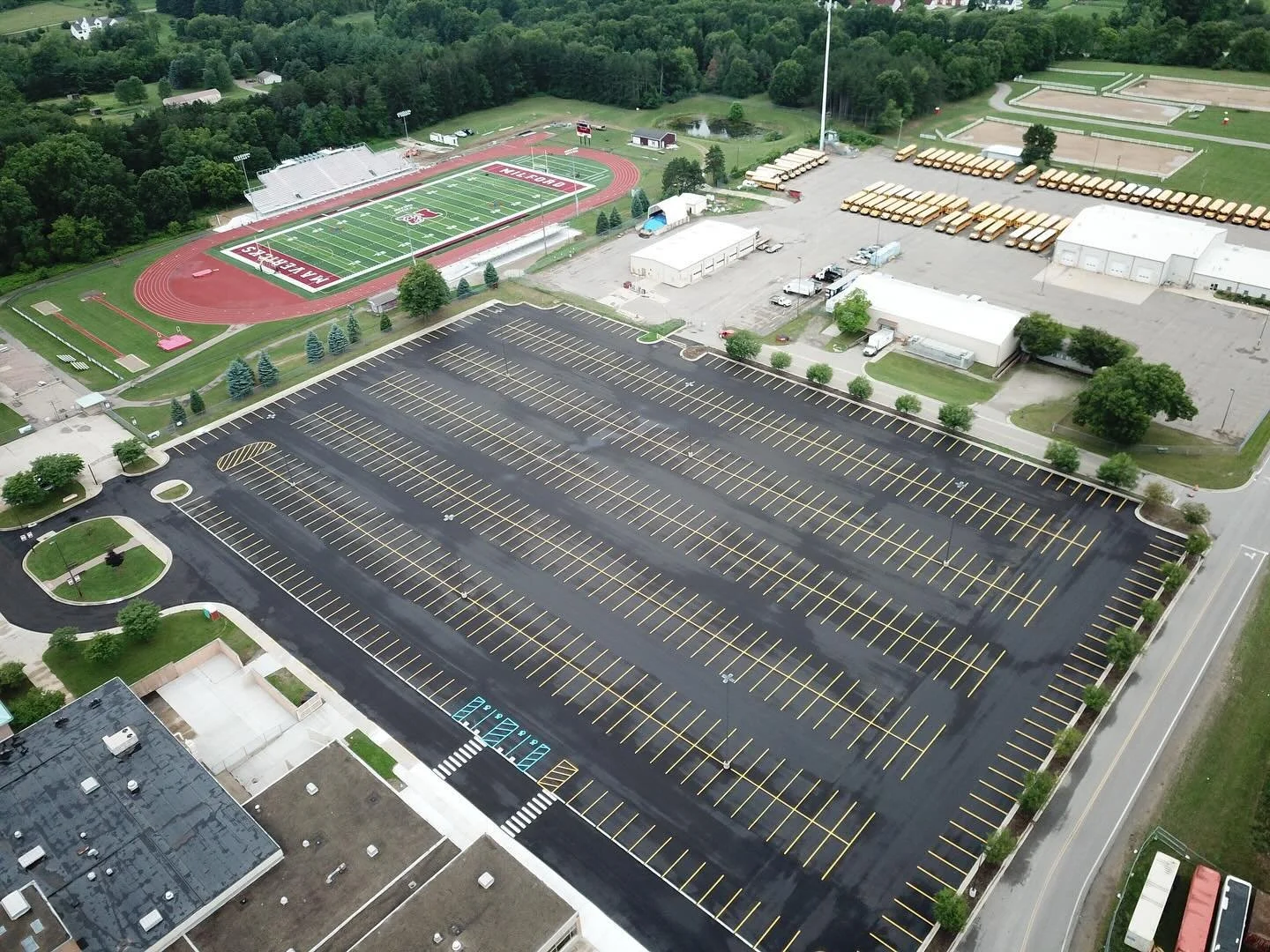 Throwing it back to when we paved the way for excellence at Milford High School! #throwbackthursday #asphaltpaving #constructionlife #paving #pavingcontractor