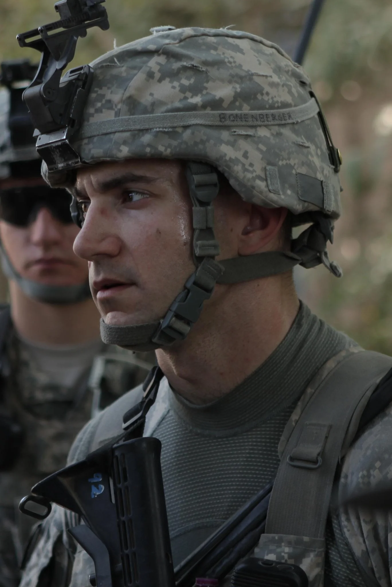 Bonenberger wearing camouflage and a tactical helmet with a mount for night vision goggles during his second deployment to Afghanistan.