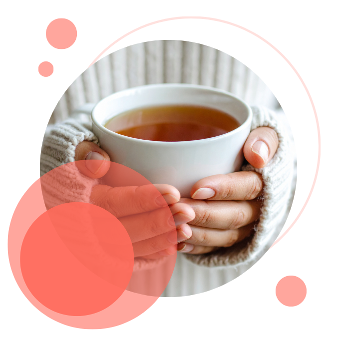 A person in a cozy, oversized white knit sweater holds a warm mug of tea. Soft sunlight casts gentle shadows, creating a relaxed, comforting atmosphere.