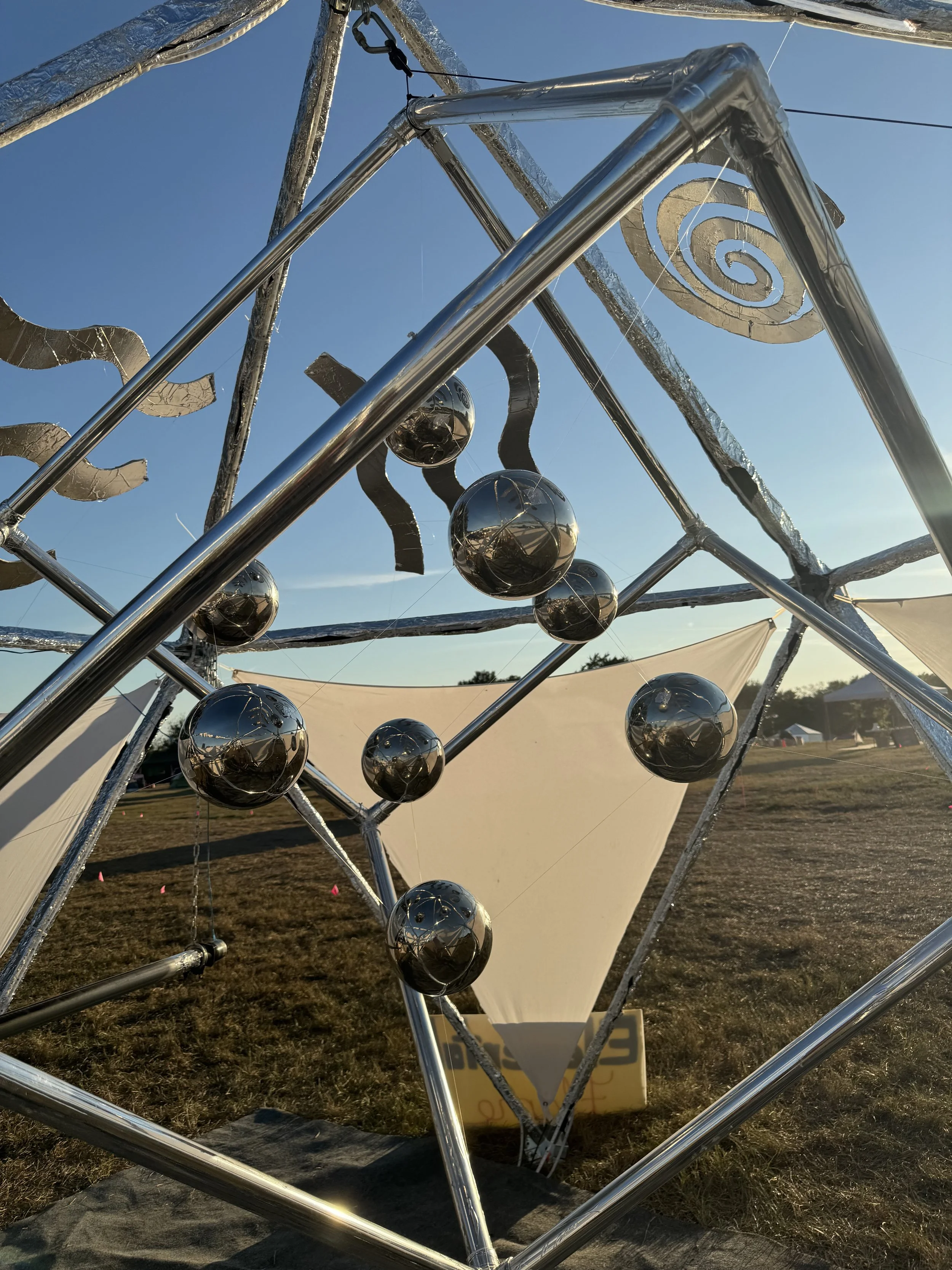 Merkaba kinetic sculpture by Stillpoint reflecting ambient light