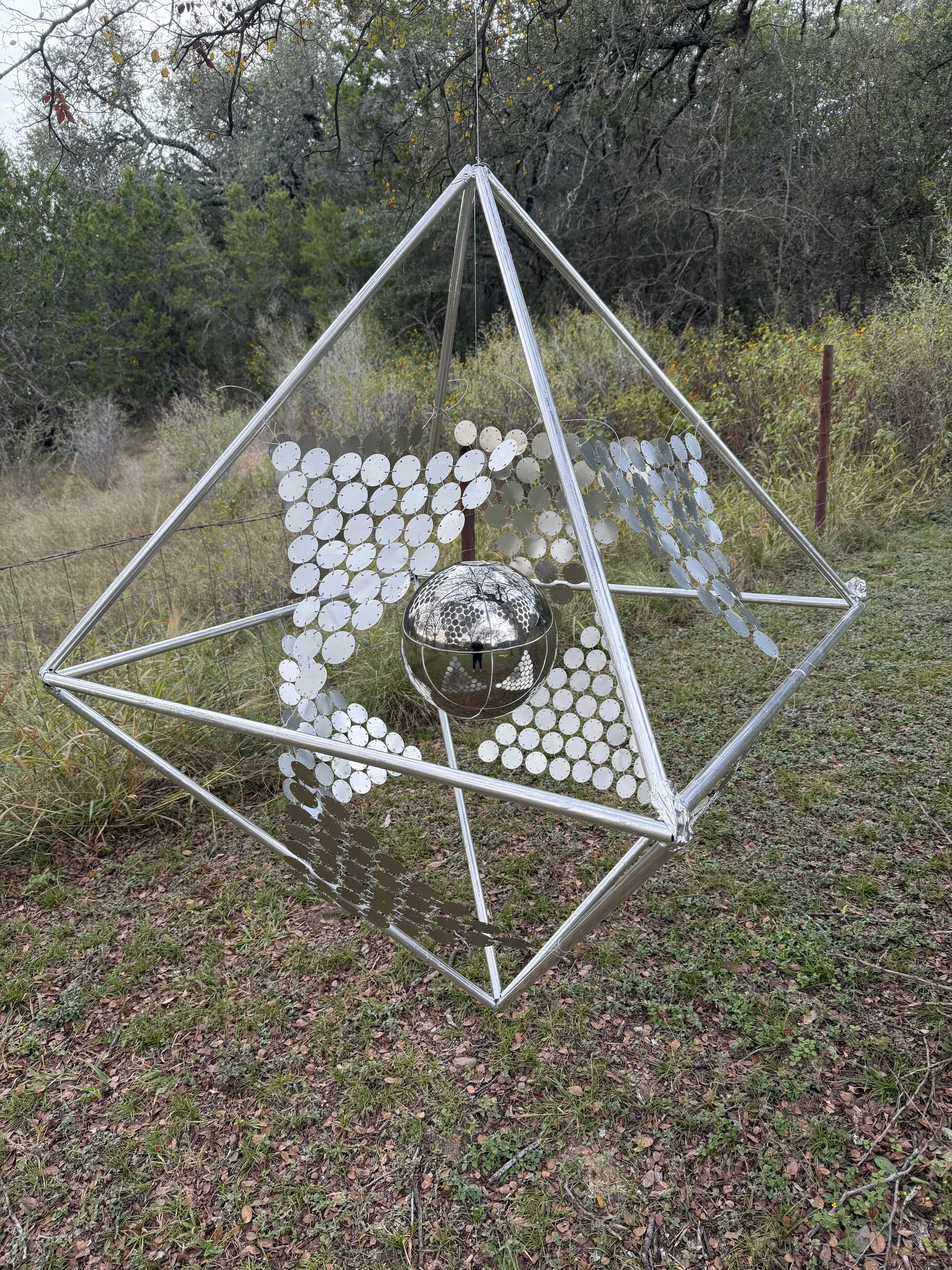 Threshold kinetic sculpture reflective discs by Stillpoint