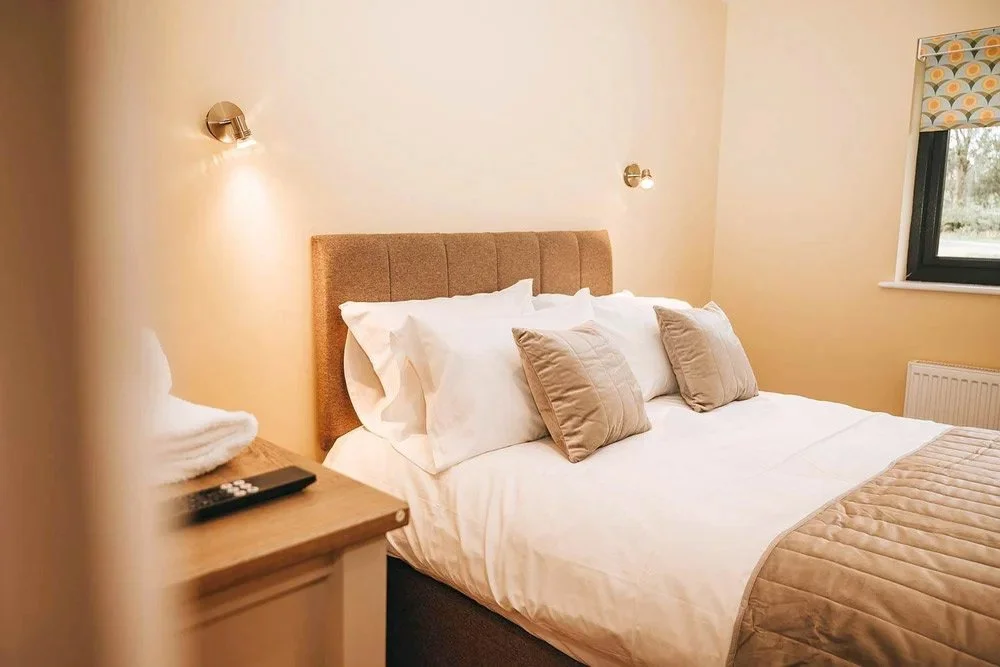 Enjoy luxury, comfort and peace in your Beacons View holiday lodge bedroom overlooking the Brecon Beacons in Wales.
