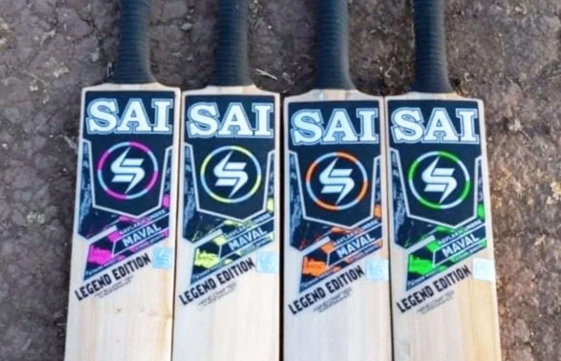 Four skateboards with colorful graphics and the text "SAI", "MAVAL", and "LEGENDE EDITION" positioned on the ground.