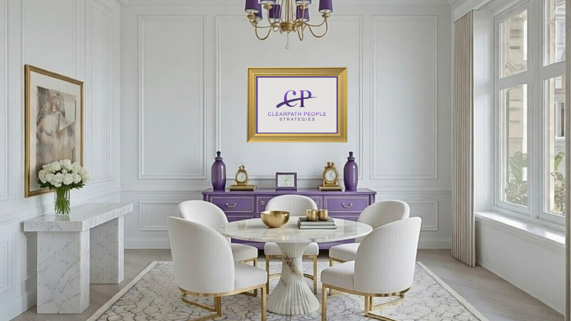Elegant dining room with white walls, large windows with curtains, a round marble table surrounded by six white upholstered chairs with gold accents, purple decorative vases and clocks on a purple sideboard, a framed artwork, a bouquet of white flowers on a marble console, and a chandelier with purple shades.