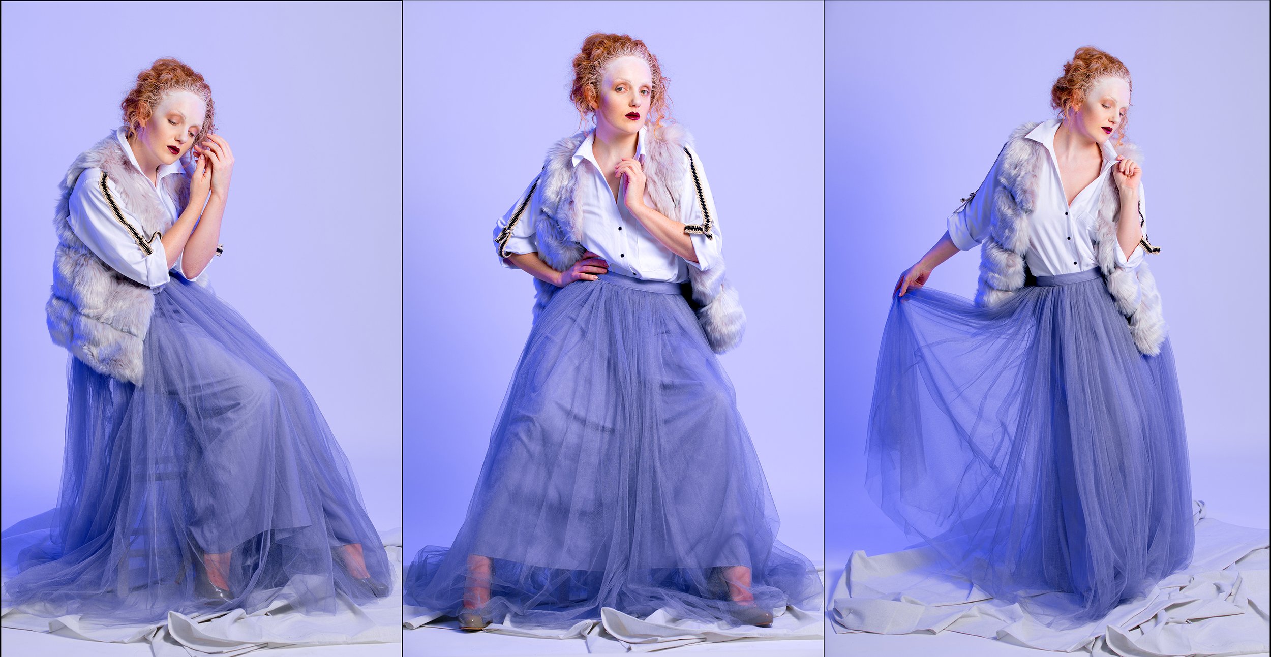 A woman with curly red hair wearing a white blouse, a fur vest, and a long purple tulle skirt poses against a plain light blue background in three different positions.