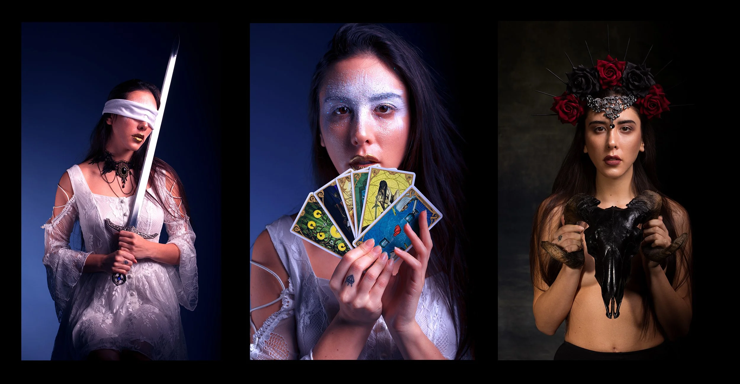 Three women in fantasy costumes: the first with a blindfold holding a sword, the second with glittery makeup holding tarot cards, the third with a floral crown holding a ram skull.