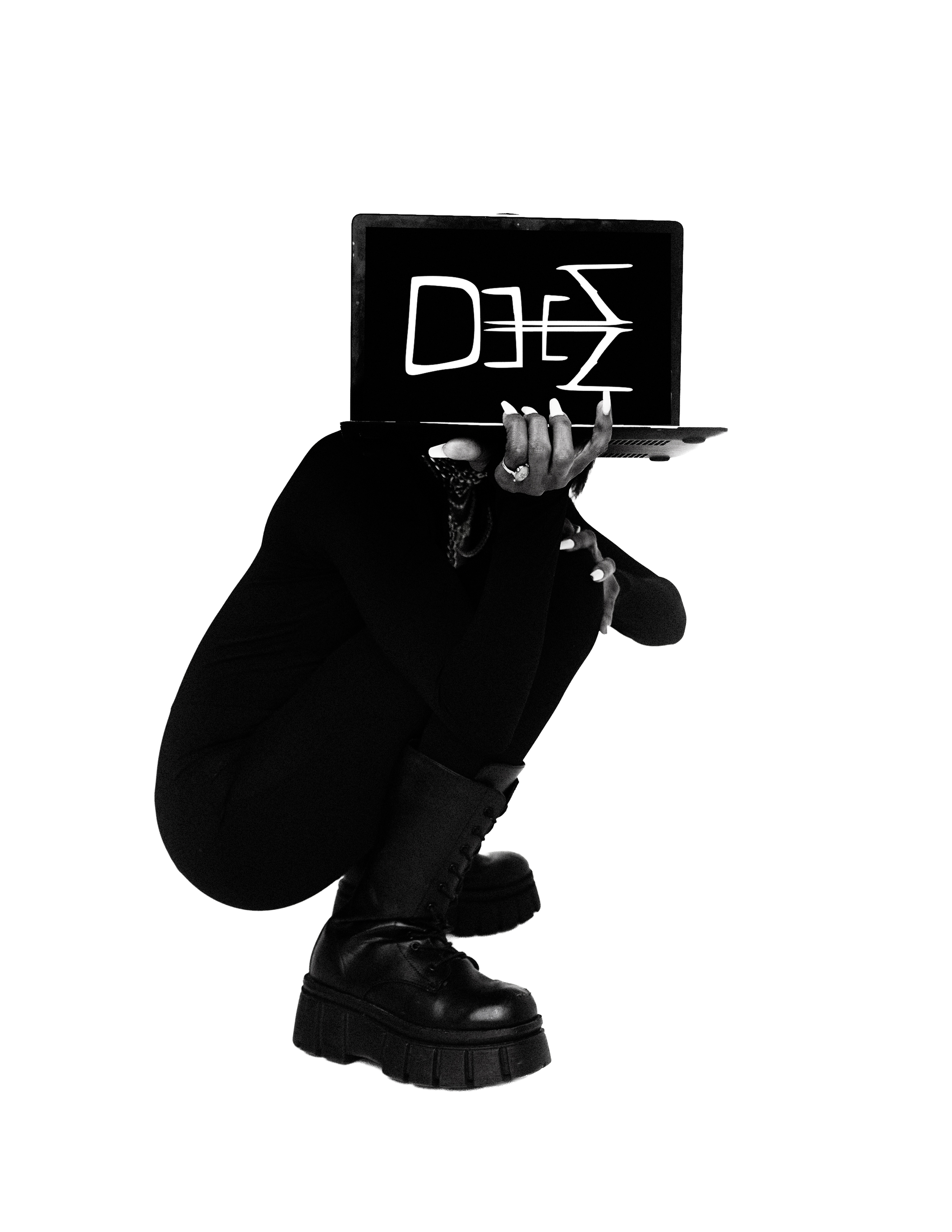 Person crouching, wearing black boots and black clothing, holding a laptop in front of their face. The laptop displays the word 'DEAD' written upside down, with a stylized peace sign underneath. Background is black.