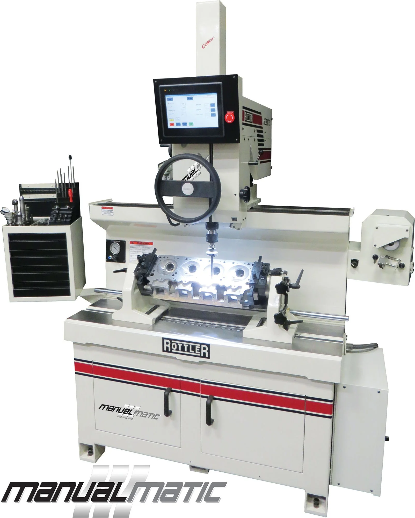 A CNC milling machine with a control screen, mounted on a white table with a labeled front, working on a metal engine cylinder head with visible circular openings, surrounded by tools and equipment.
