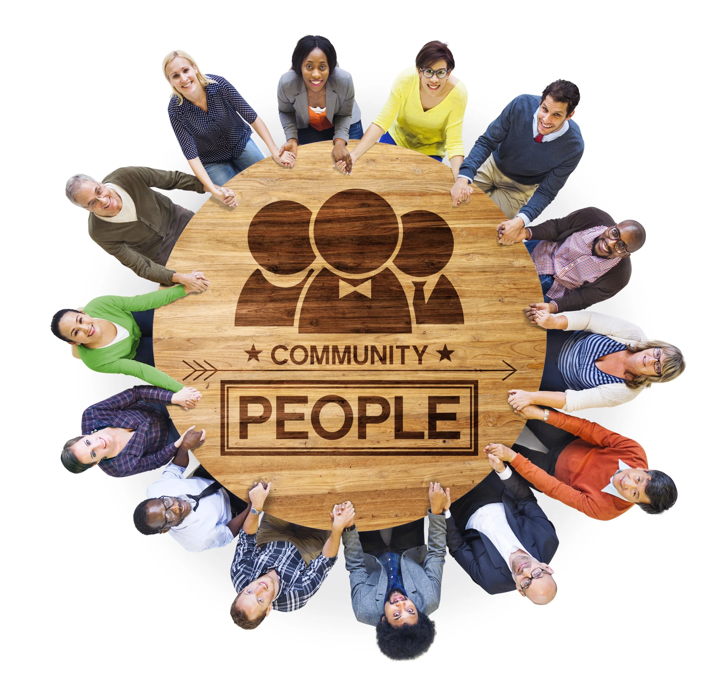 A diverse group of people holding hands around a round wooden table with a graphic of three people and the words 'Community' and 'People' engraved on it.