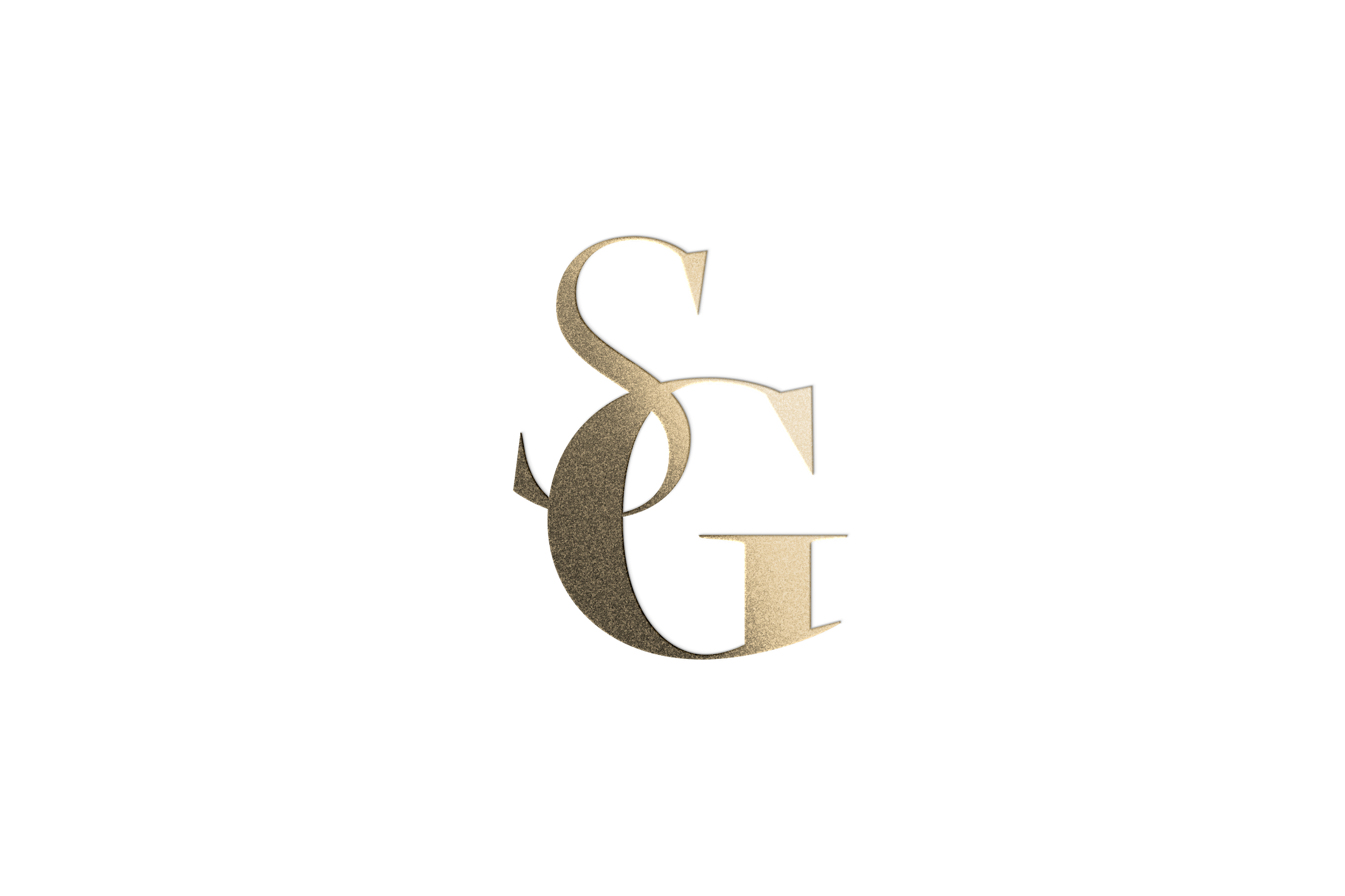 Close-up of a metallic letter 'E' with a black and gold color scheme on a black background.