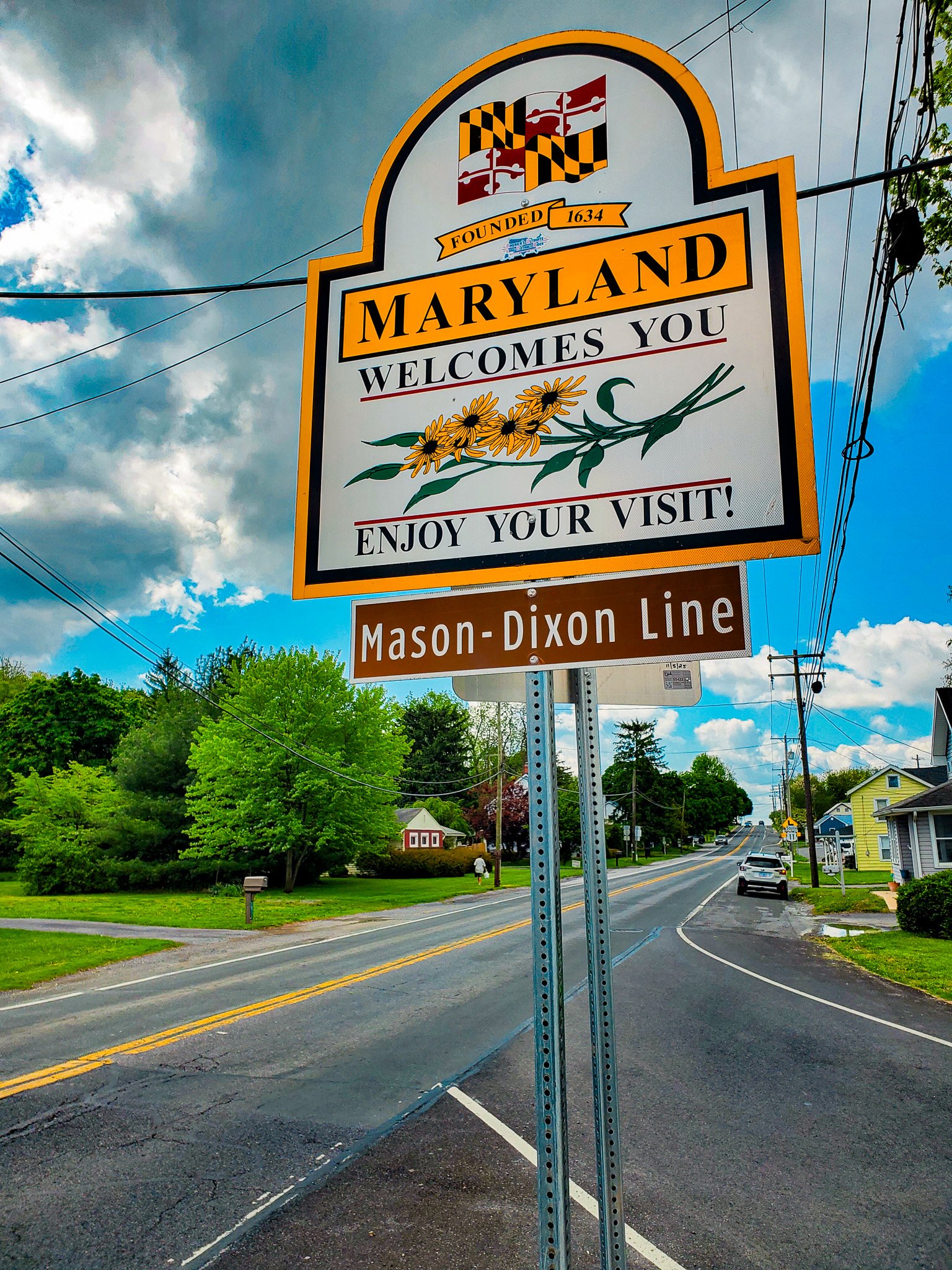 Mason Dixon line sign on Maryland Welcome sign.jpg