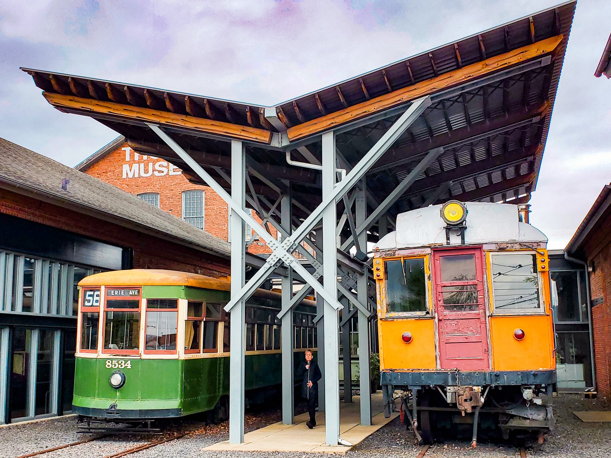 Two trolleys outside under cover at Scranton Trolley Museum.jpg