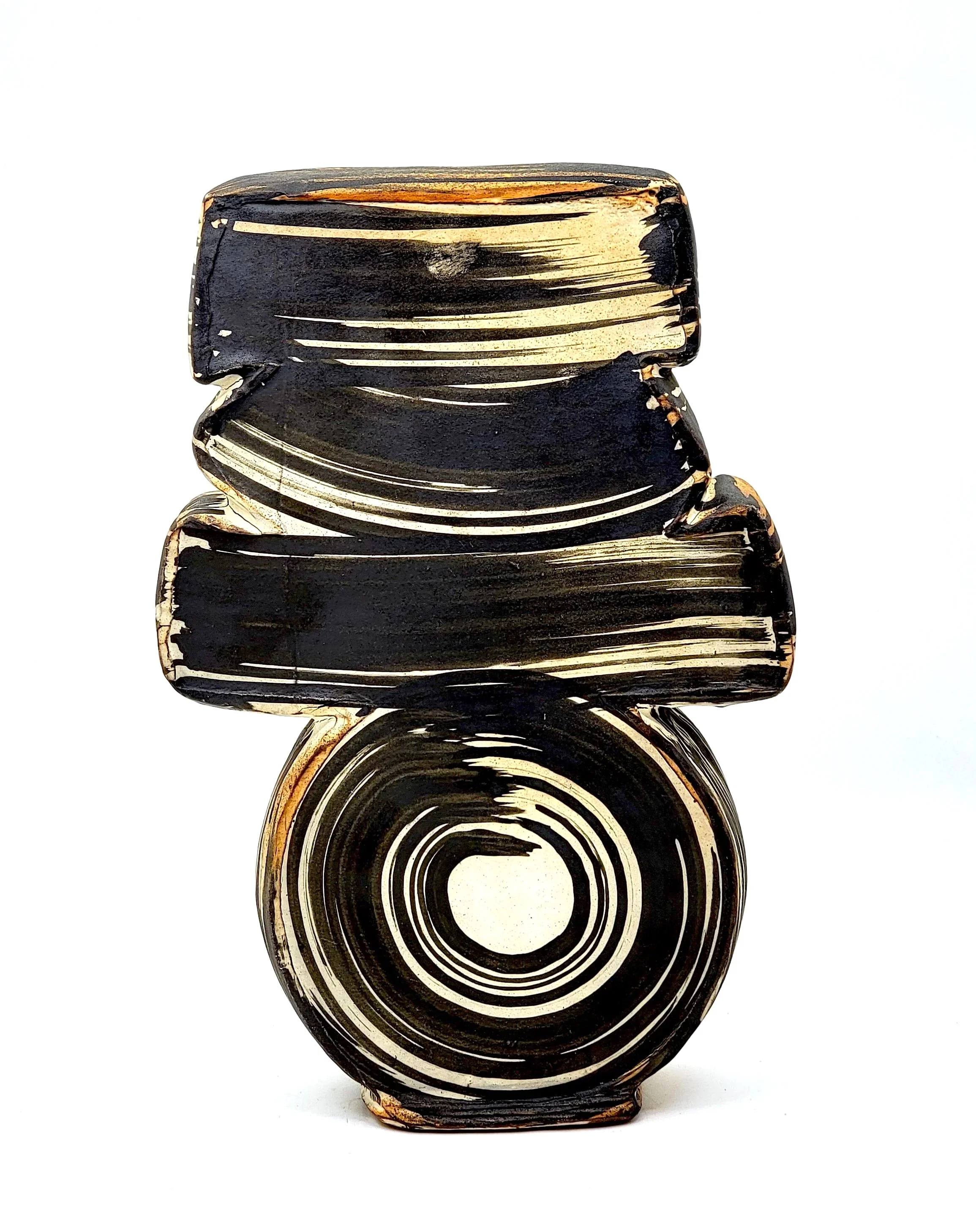 Black and beige ceramic vase with geometric shapes and circular patterns.