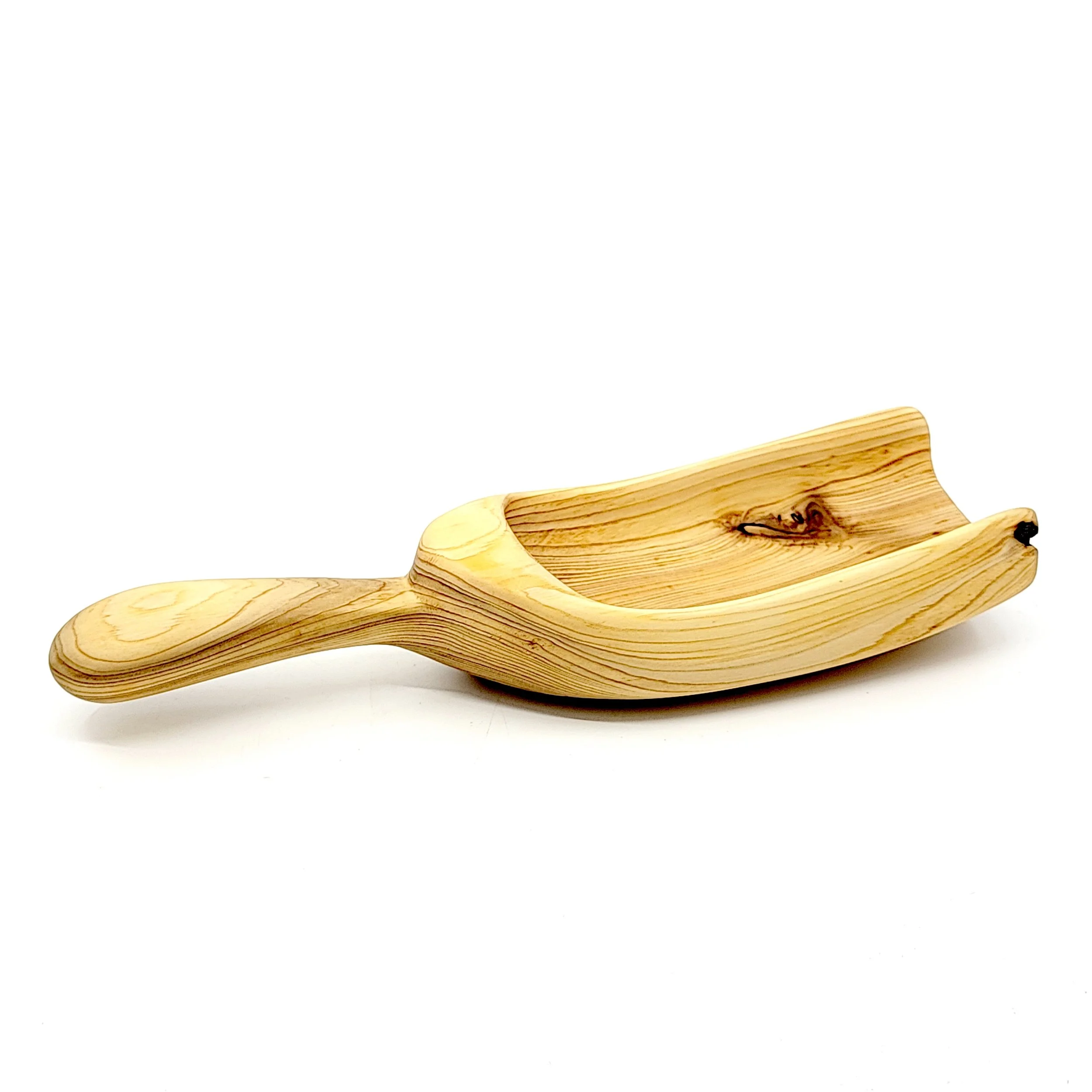 Wooden scoop shaped like a shovel.