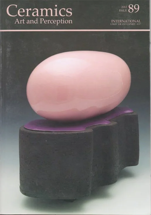 Cover of Ceramics: Art and Perception magazine, issue 89 from 2012, featuring a large pink ceramic oval sculpture placed on a purple and black base.