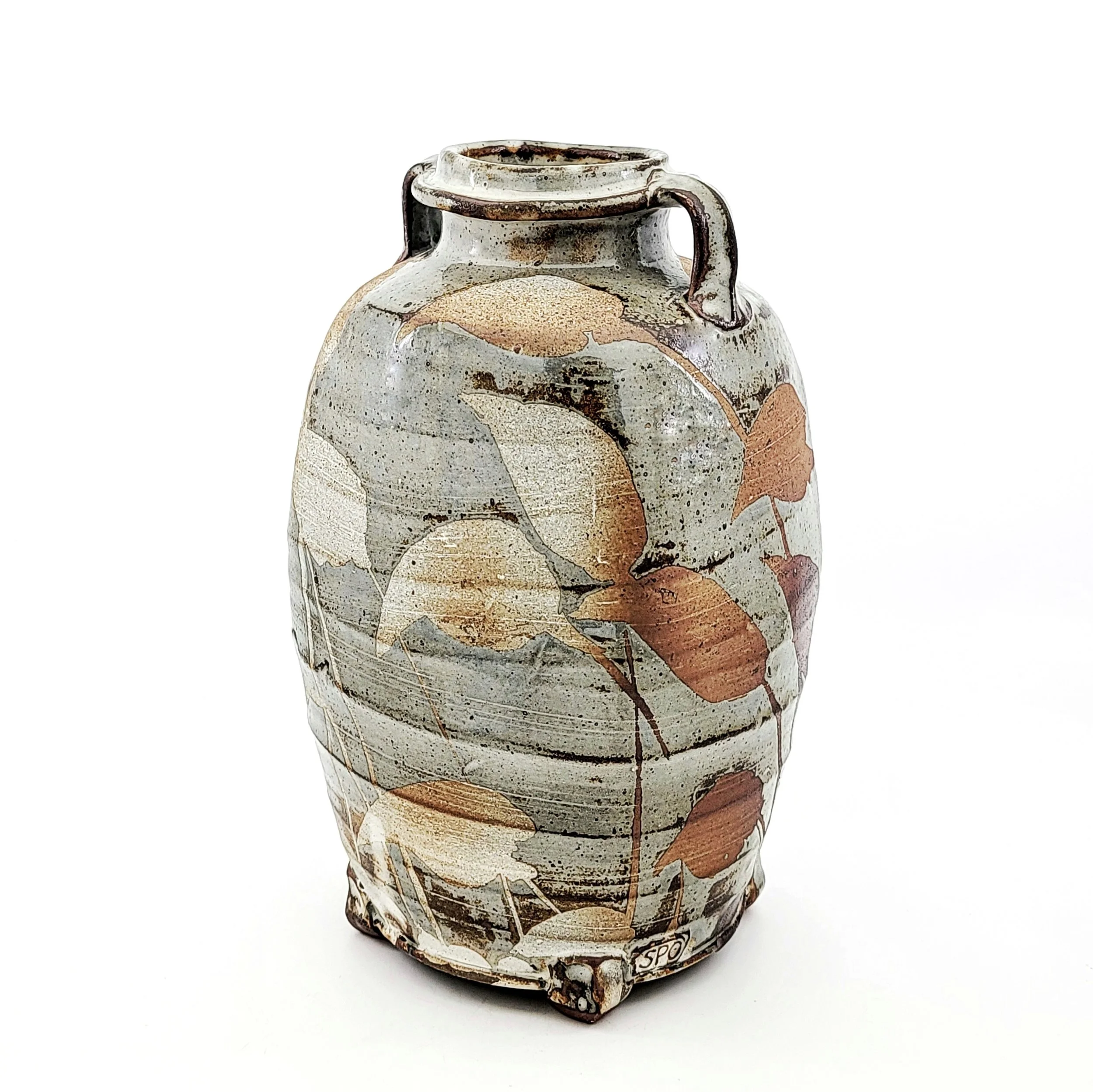 Decorative ceramic vase with a nature-inspired design of leaves in neutral colors.