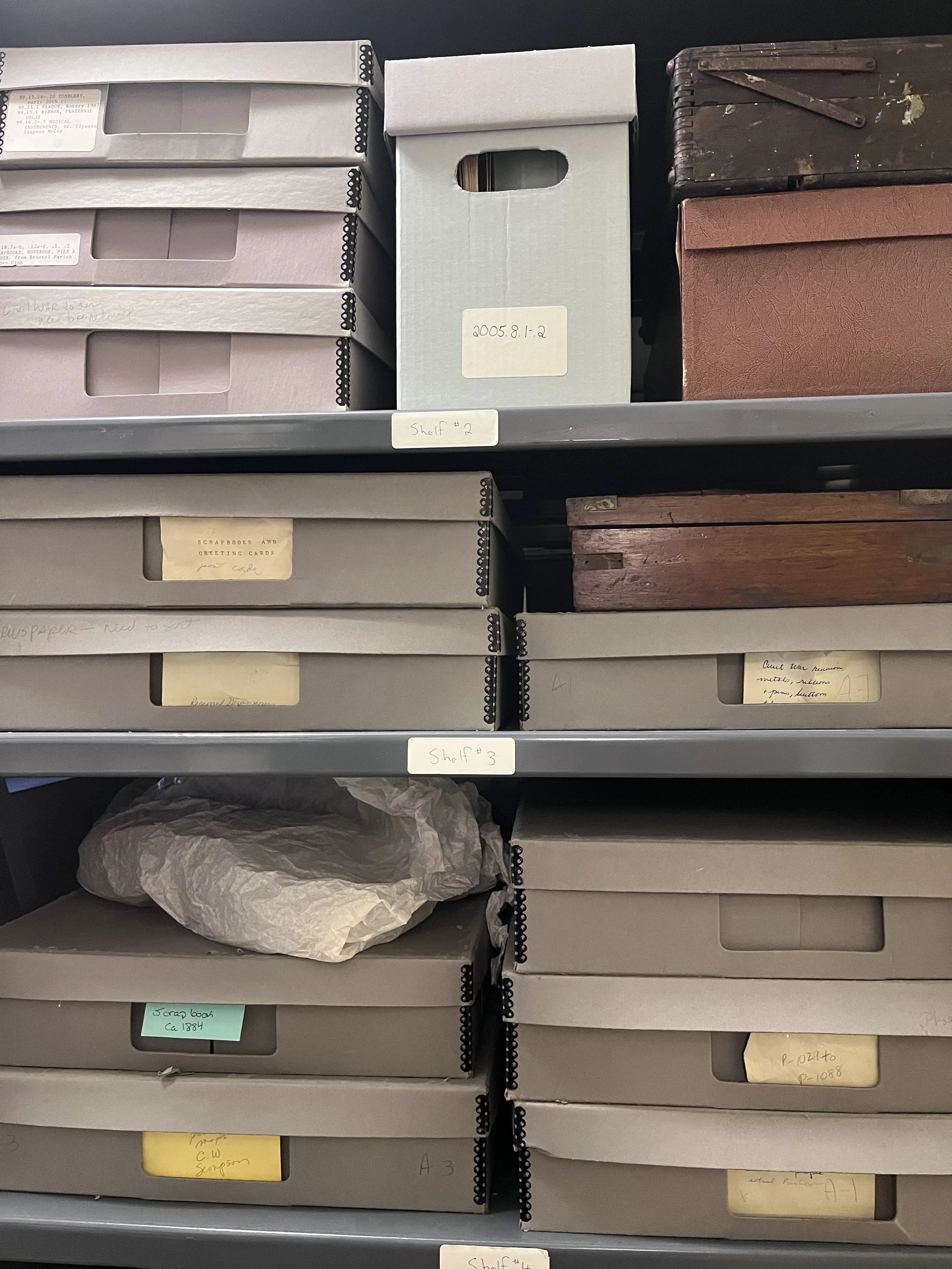 Archival storage acid free organization boxes,  labels indicating contents