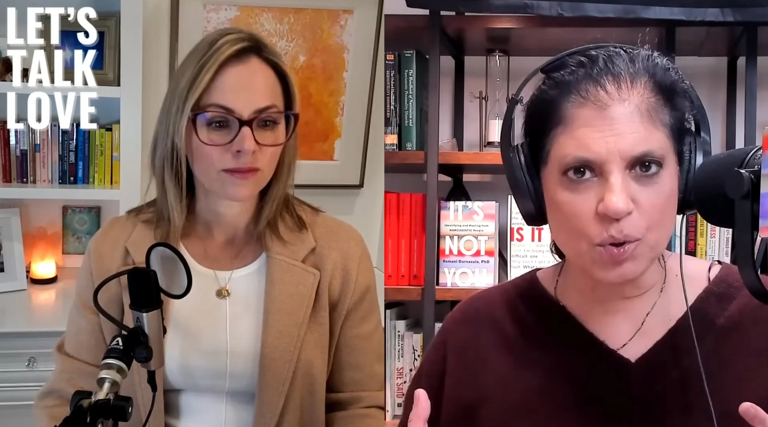 Two women appear in a split-screen video call. The woman on the left has blonde hair, glasses, and is wearing a tan blazer. She is seated in a room with bookshelves and artwork. The woman on the right has dark hair pulled back, is wearing large headphones, and is speaking into a microphone, with a bookshelf behind her containing books and decorative items.