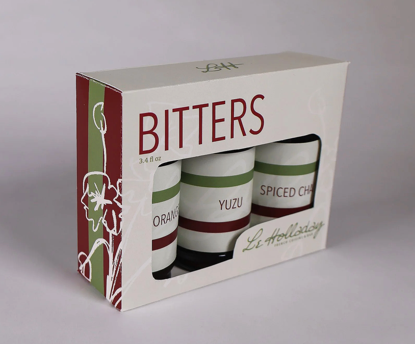 Set of three spice jars labeled orange, yuzu, and spiced chiles in a white box with red and green accents.