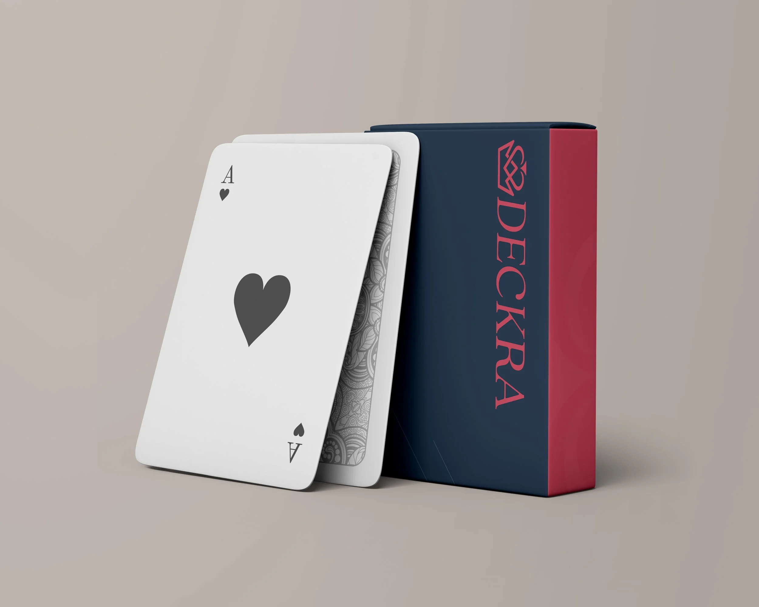 Ace of hearts playing card leaning against a deck box labeled 'DECKXURA'.