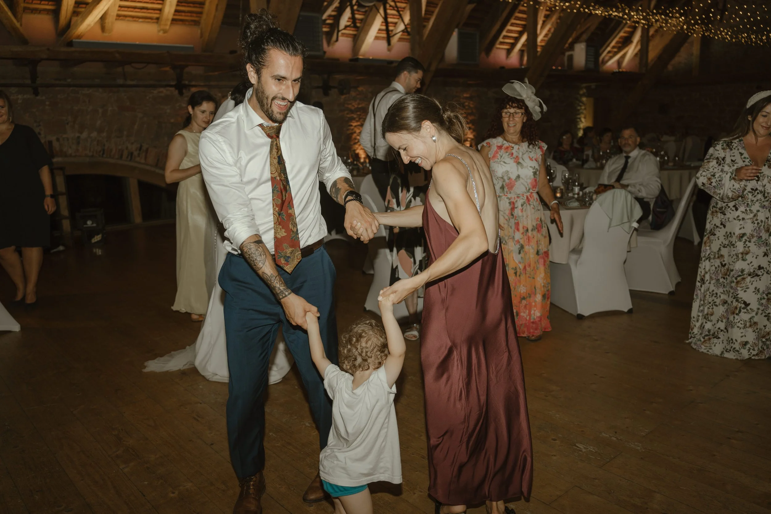 People dancing and enjoying at a wedding reception.