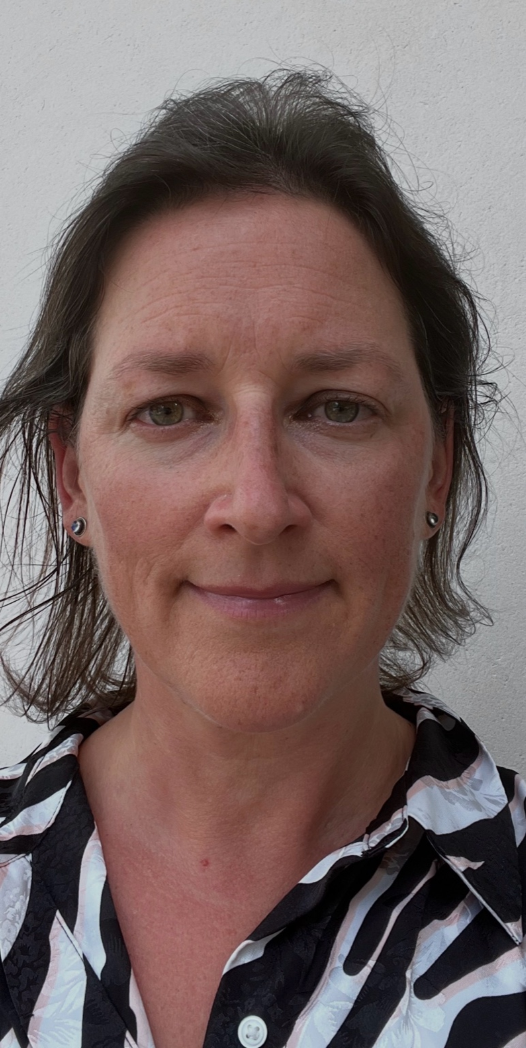 picture of brown haired woman in front of white background