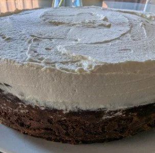 Side view of Chocolate Ganache whipped Cream Cheesecake cropped.jpg