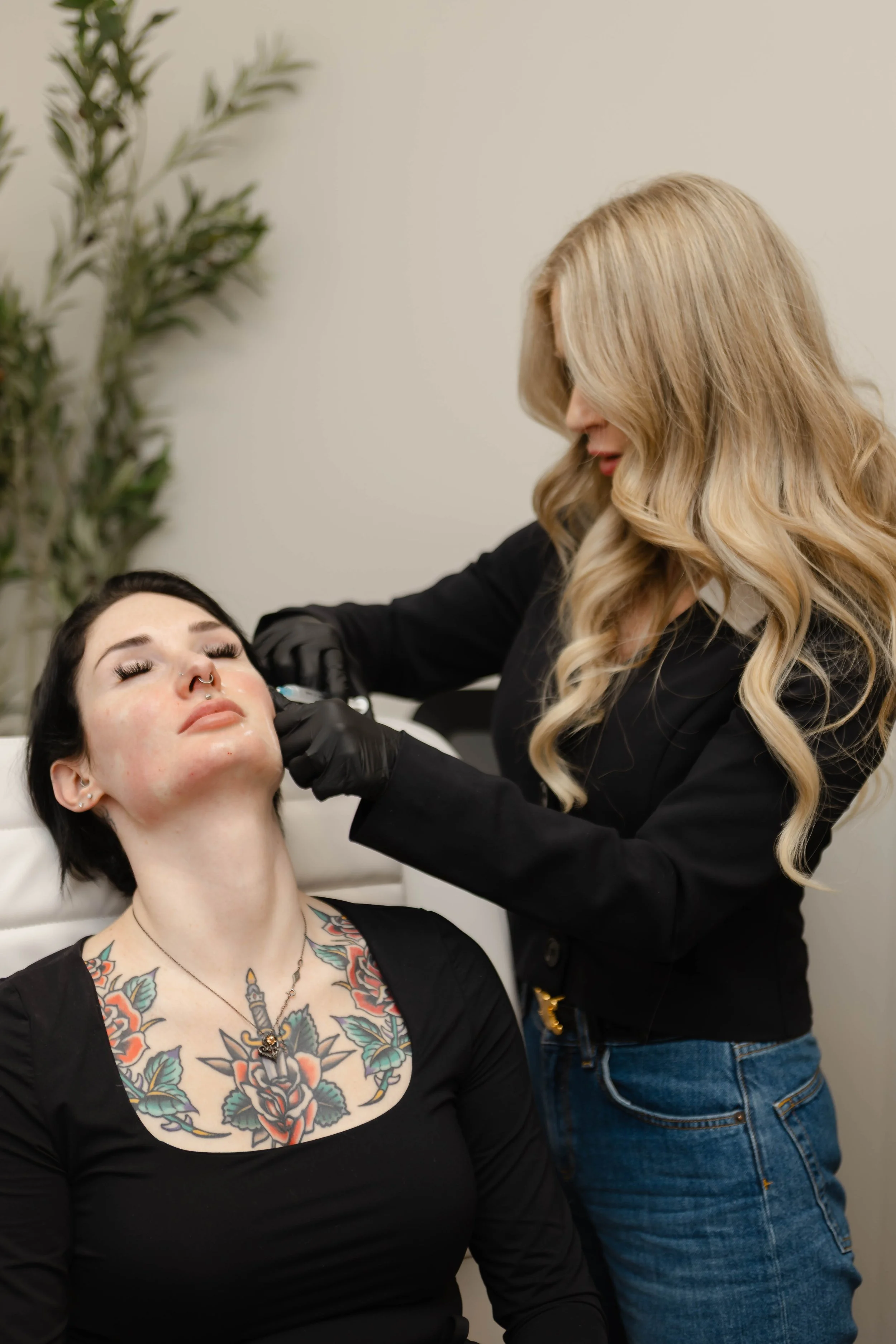A woman receiving a cosmetic injection of Sculptra and Dysport from a practitioner in a clinical setting.