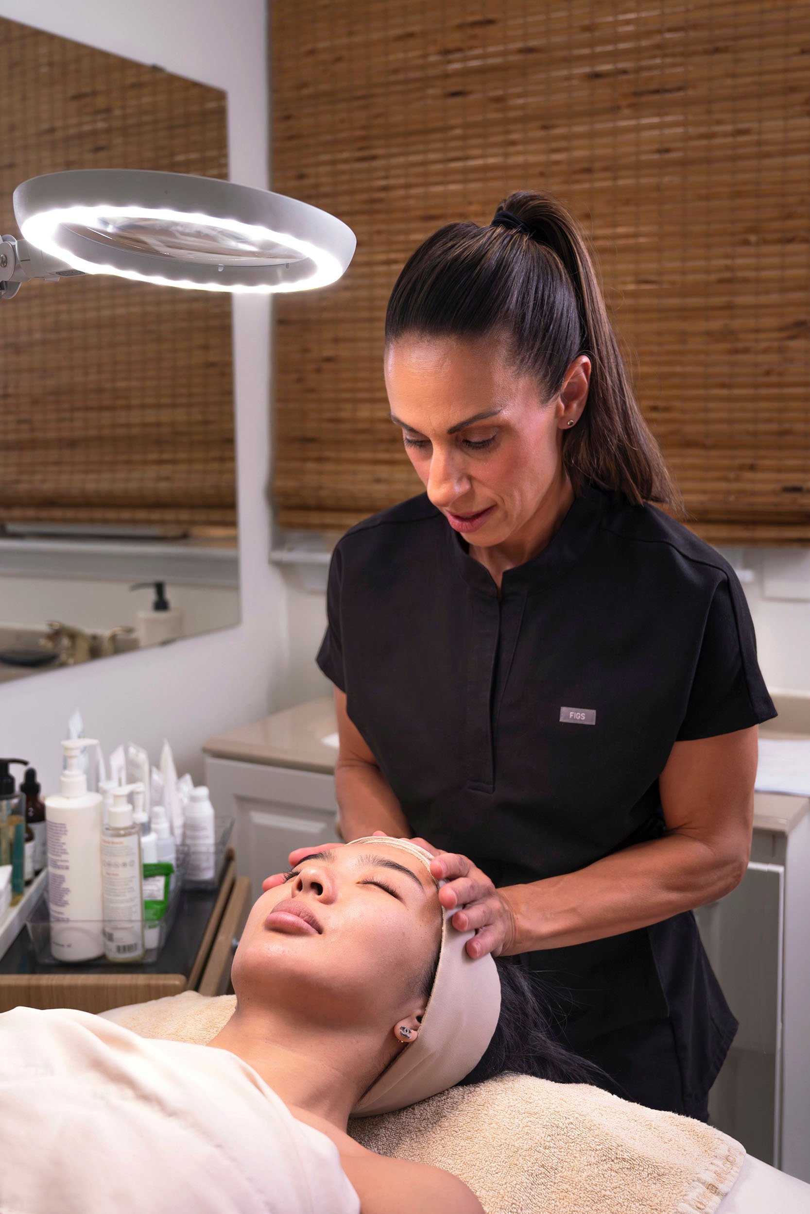 Liz Clapsis providing a facial treatment.